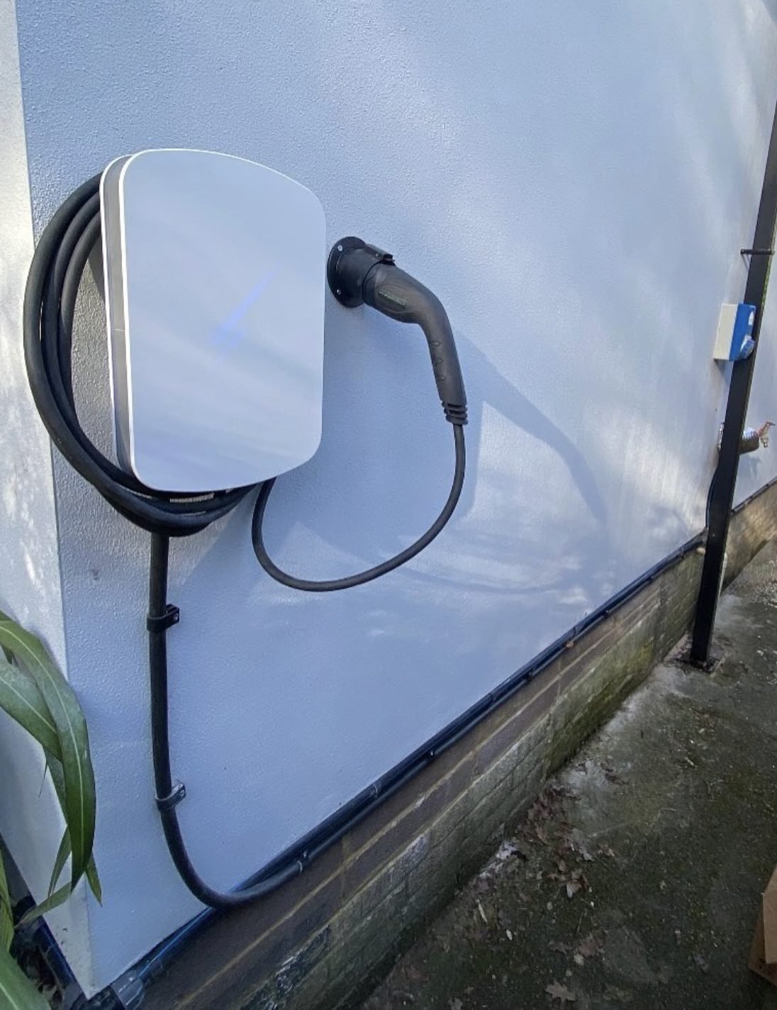EV charge point installed on an exterior wall